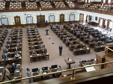 House Speaker Dade Phelan poses for a picture in the middle of the chamber as Republican...