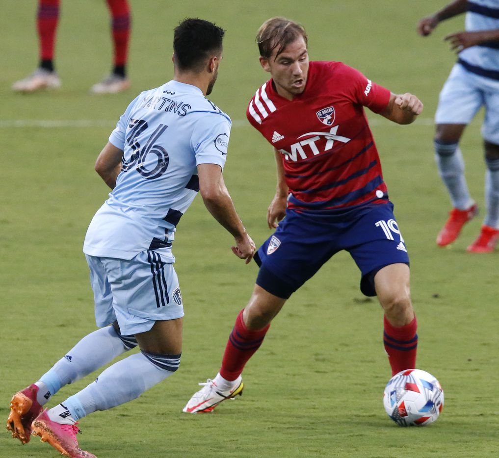 FC Dallas midfielder Paxton Pomykal (19) makes a pass as Sporting Kansas City defender Luis Martins (36) defends during the first half as FC Dallas hosted Sporting Kansas City at Toyota Stadium in Frisco on Saturday evening, August 14, 2021. (Stewart F. House/Special Contributor)