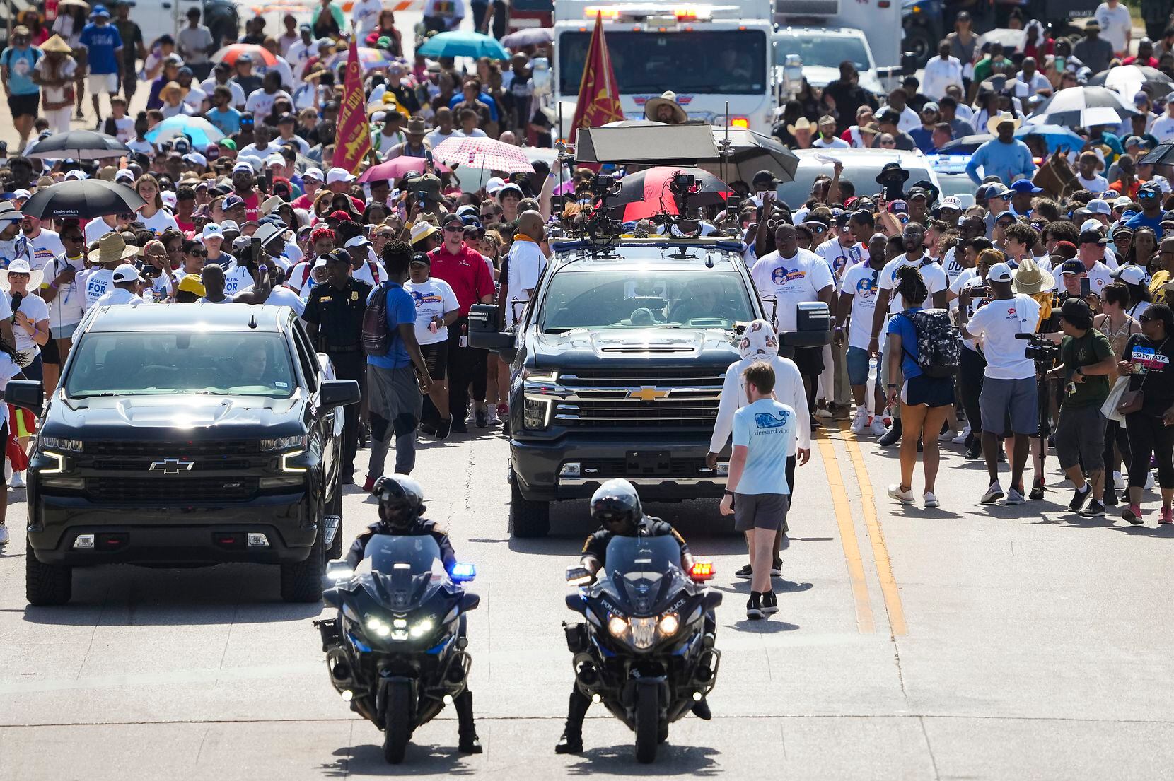 Walkers head up Pennsylvania Avenue after crossing IH-35W during the 2022 Opal's Walk for...