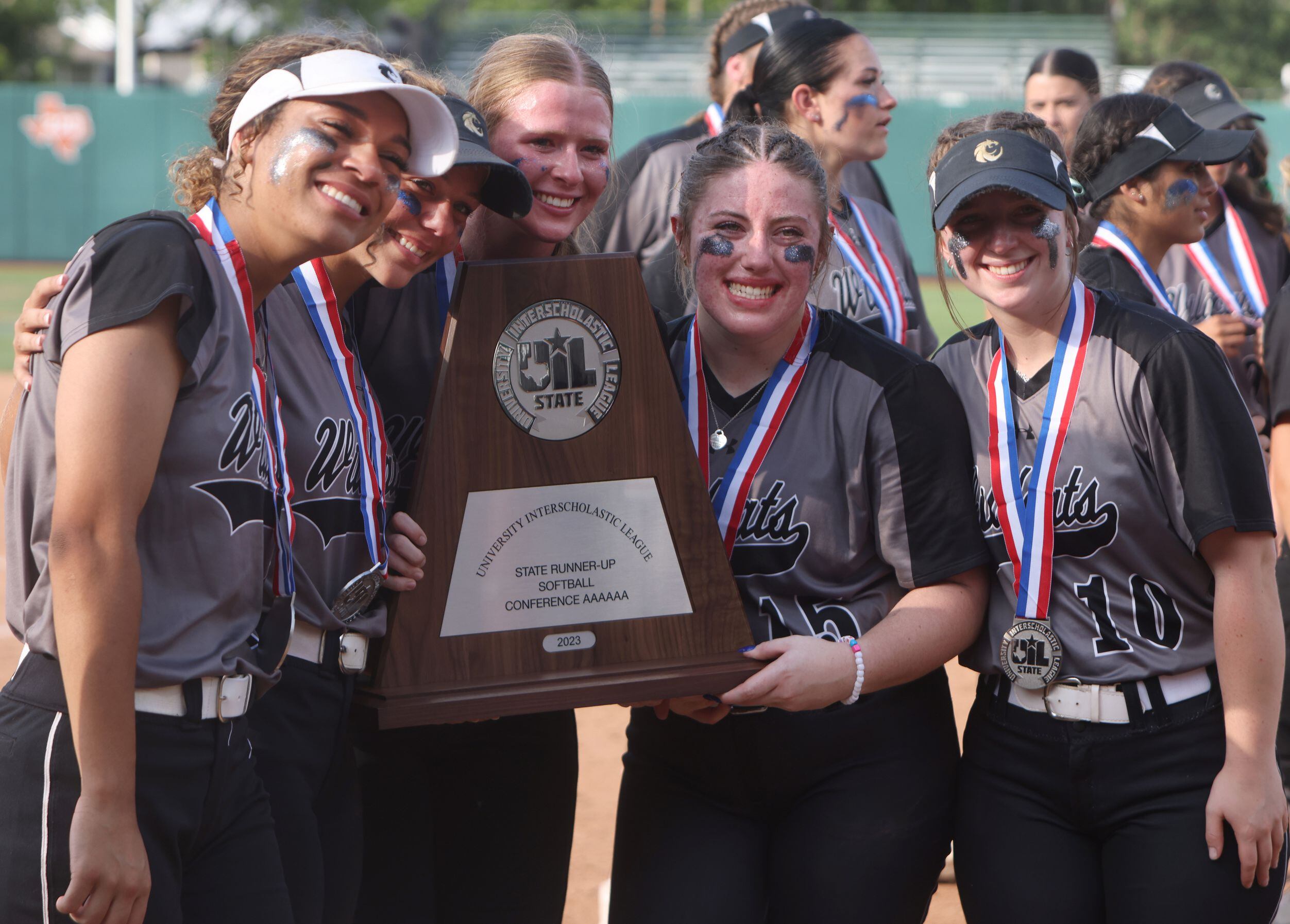 Senior  Denton Guyer players pose for a photo with the 6A runner-up trophy following the...