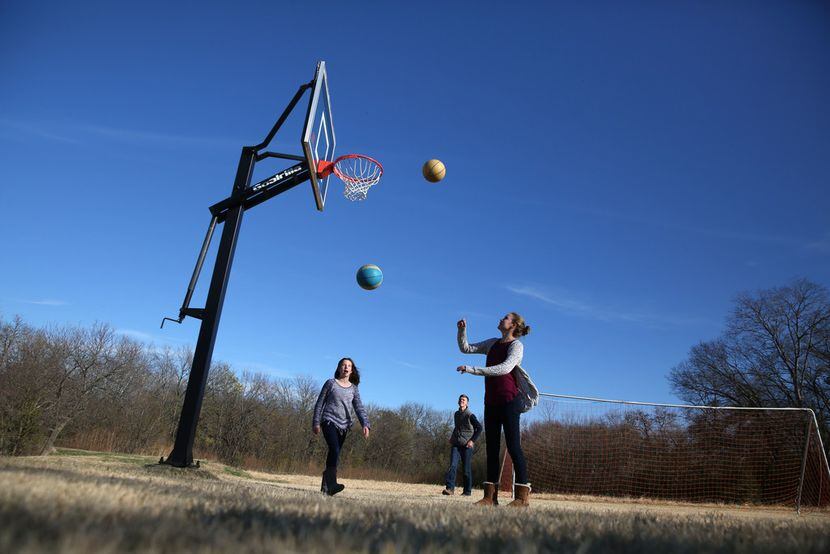 Kelly Blake, 13, (far right) played basketball with her sister Keaton Blake, 11, and brother...