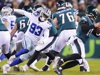 Philadelphia Eagles quarterback Gardner Minshew (10) scrambles away from Dallas Cowboys...