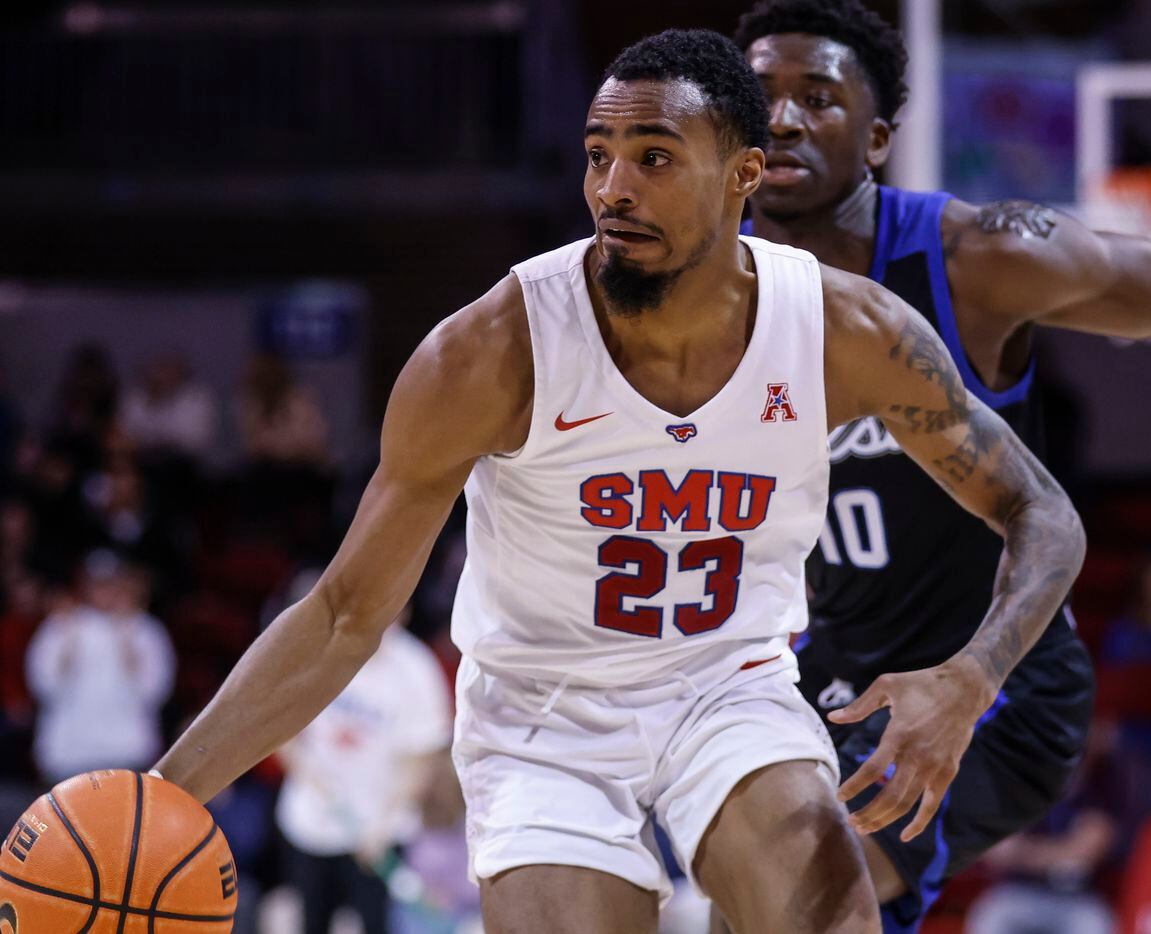 Southern Methodist Mustangs guard Michael Weathers (23) dribbles the ball up the court as...