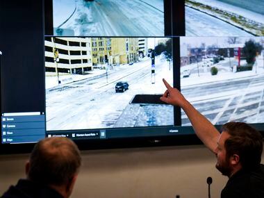 Monitors show views of various traffic conditions in the Dallas Emergency Operations Center...