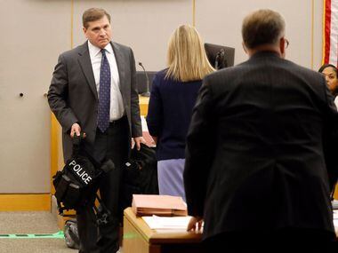 Prosecutor Jason Hermus (right) asks for court to recess as fired Dallas police officer...