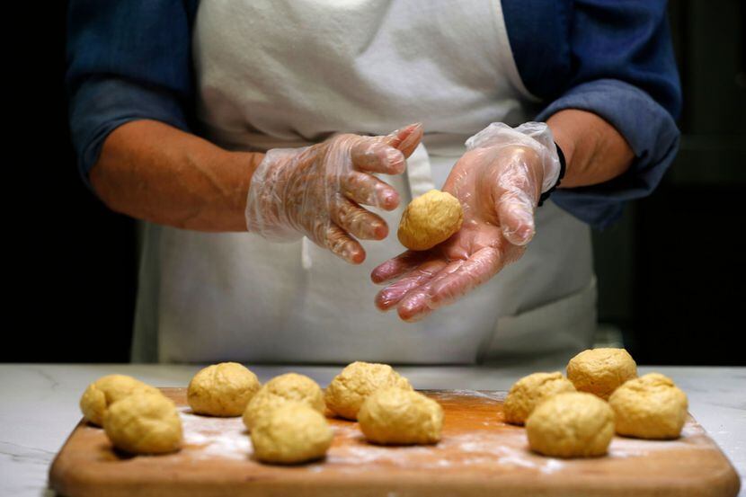 Dotty Griffith rolls dough for flour tortillas 