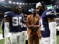 Former Dallas Cowboys Hall of Famer Michael Irvin congratulates Cowboys running back Ezekiel...