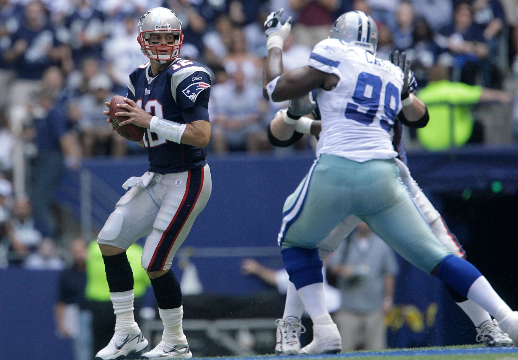 New England Patriots quarterback Tom Brady (12) passes against the Dallas Cowboys in their...