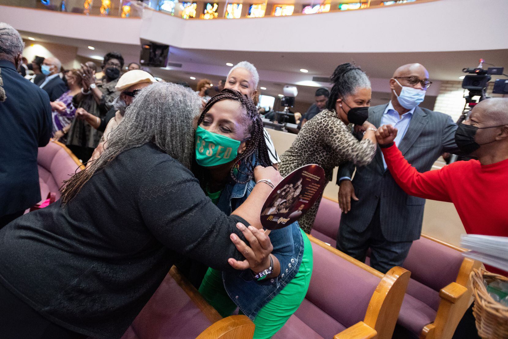 Church members Jyla Kuykendall (left) and Karen Stepherson hugged Sunday at the start of the...