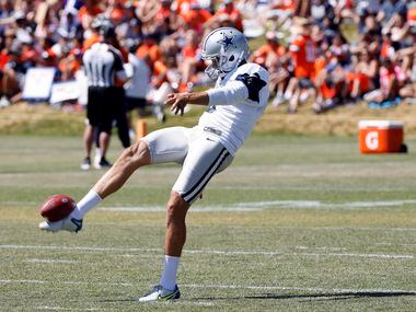 Dallas Cowboys punter Bryan Anger (5) kicks before a joint practice with the Denver Broncos...