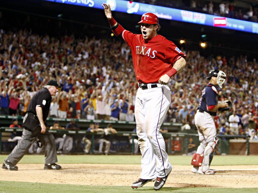 Texas Rangers outfielder Josh Hamilton reacts as he crosses the plate and ties the Boston...