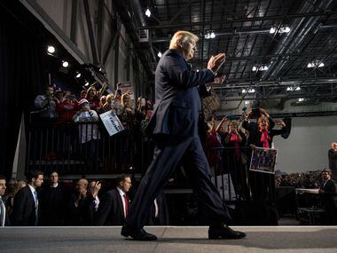 Donald Trump takes the stage to his final campaign event at DeVos Place Convention Center in...