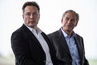 Tesla CEO, Elon Musk, left, sits with Texas Gov. Greg Abbott at a groundbreaking ceremony...