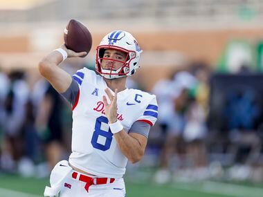 SMU quarterback Tanner Mordecai (8) warms-up before a game against UNT at Apogee Stadium in...