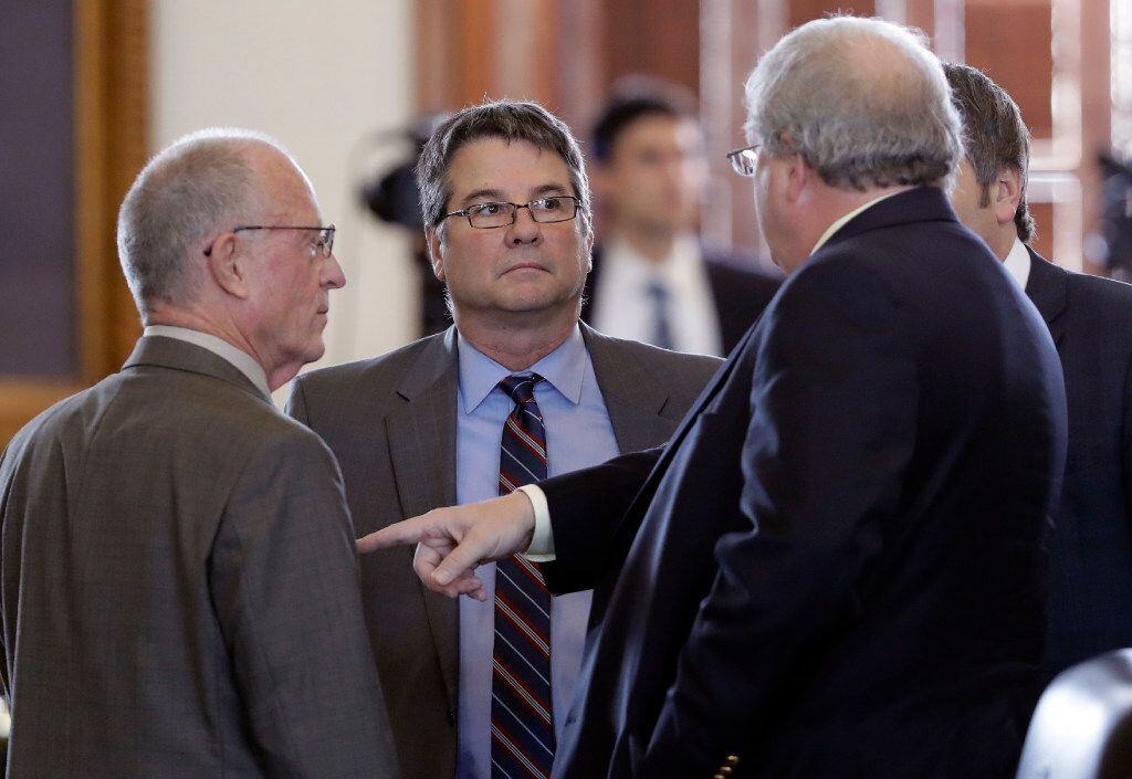 Sen. Charles Perry, R-Lubbock (center) filed Senate Bill 415 to ban what abortion opponents...