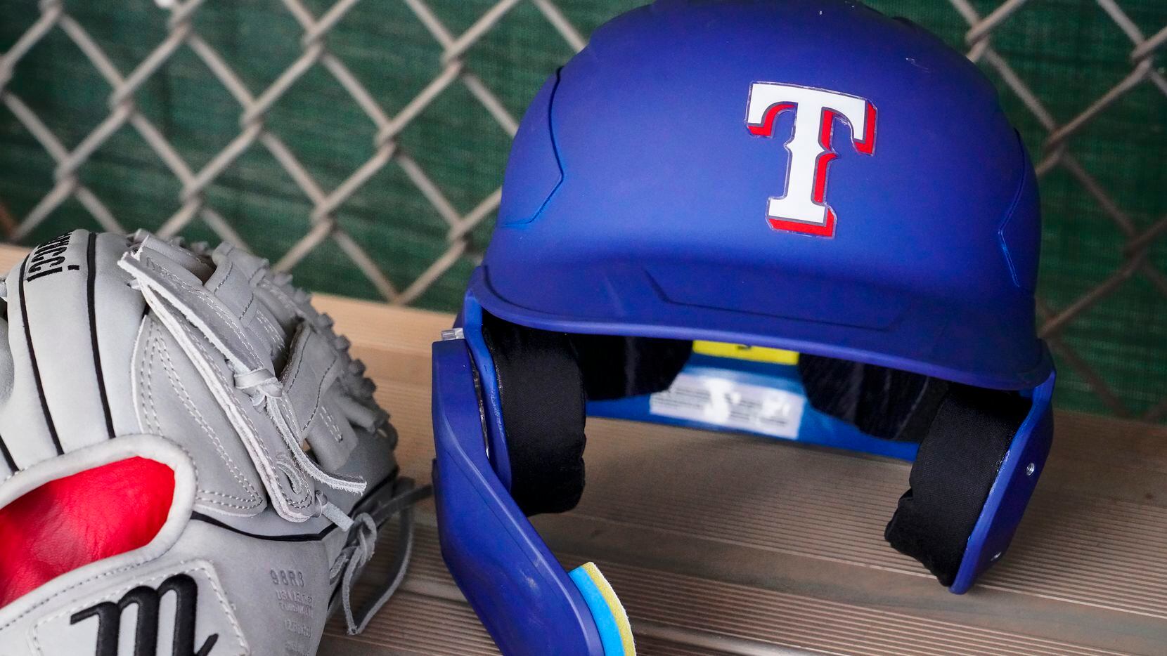 Infielder Davis Wendzel’s helmet and glove are seen in a practice field dugout during a...