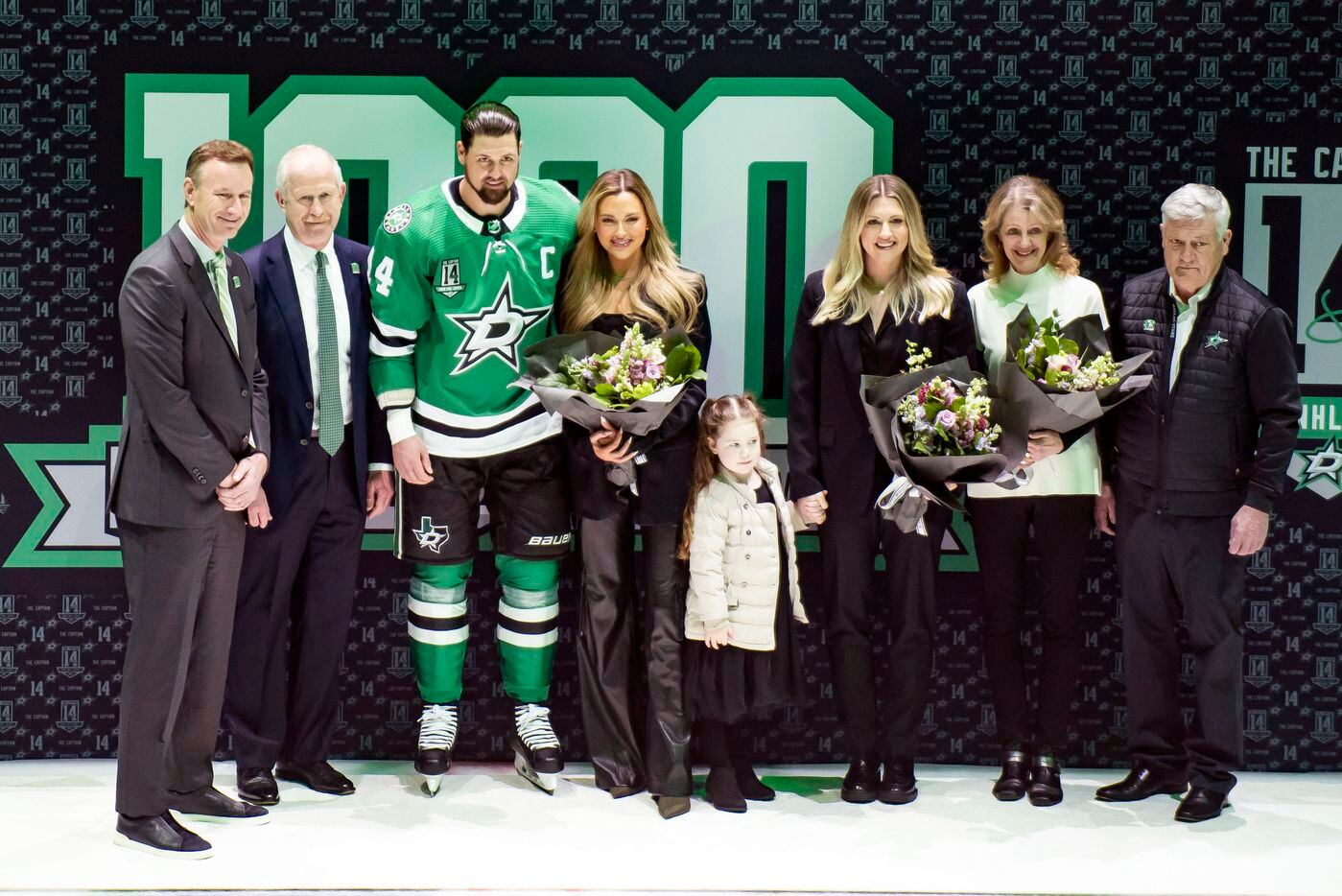 Dallas Stars left wing Jamie Benn (14) poses for a photo his family and Stars President Brad...