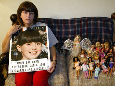Donna Norris, mother of Amber Hagerman, sits next to her daughter's dolls while at her home...