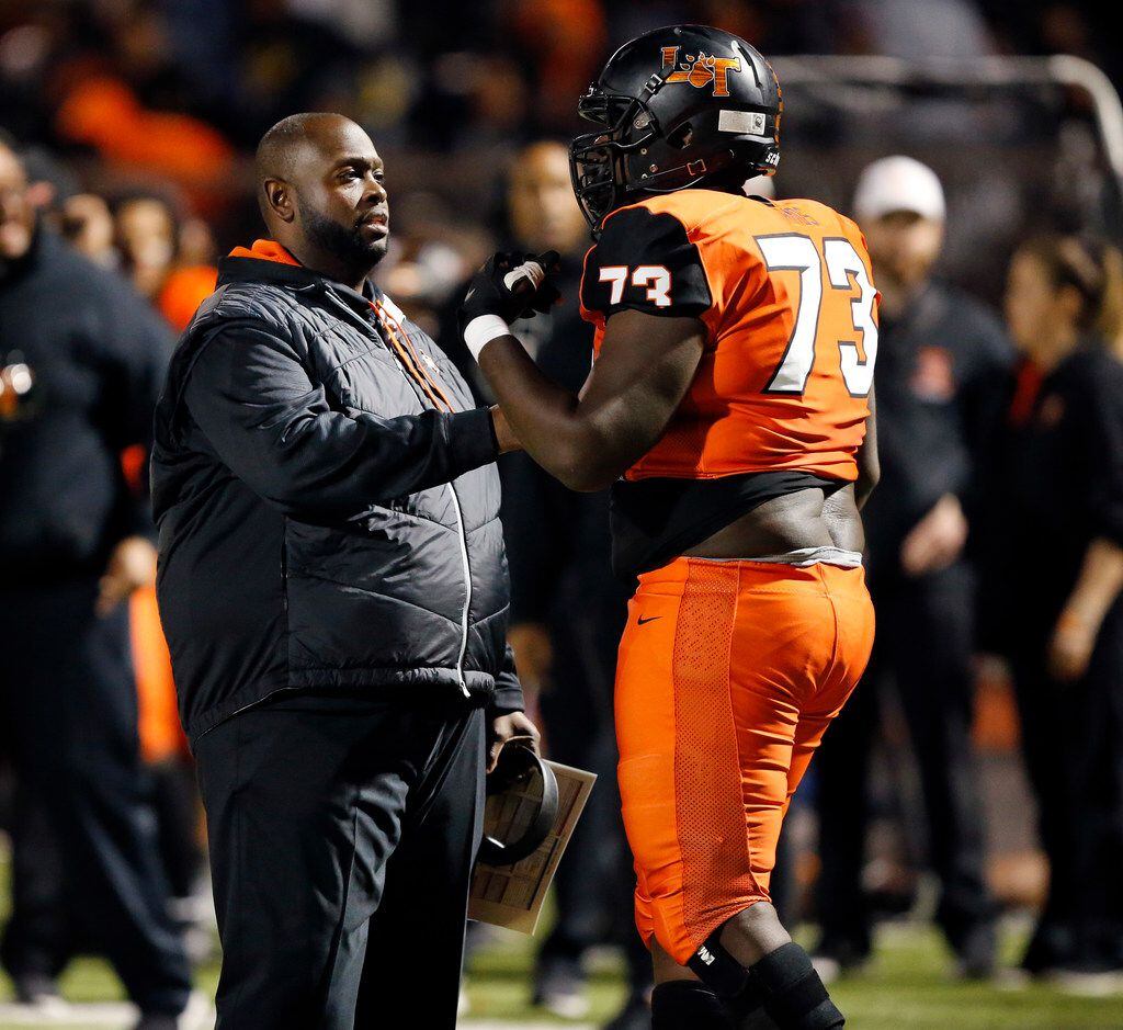 Lancaster head coach Chris Gilbert visits with his lineman Joseph Amos after a personal foul in the first half against Frisco Lone Star in their Class 5A Division I Regional championship at Wilkerson-Sanders Stadium in Rockwall, Texas, Friday, December 6, 2019. (Tom Fox/The Dallas Morning News)