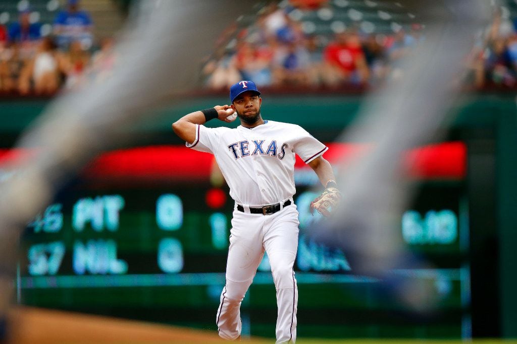 Texas Rangers shortstop Elvis Andrus (1) fields the ball and throws to first to get Toronto...