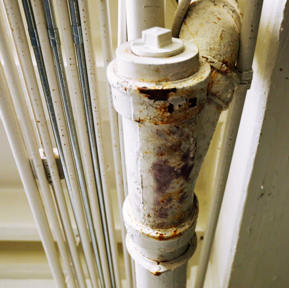 Rusty pipes are exposed in a ceiling close to South Oak Cliff High School's coaches office....