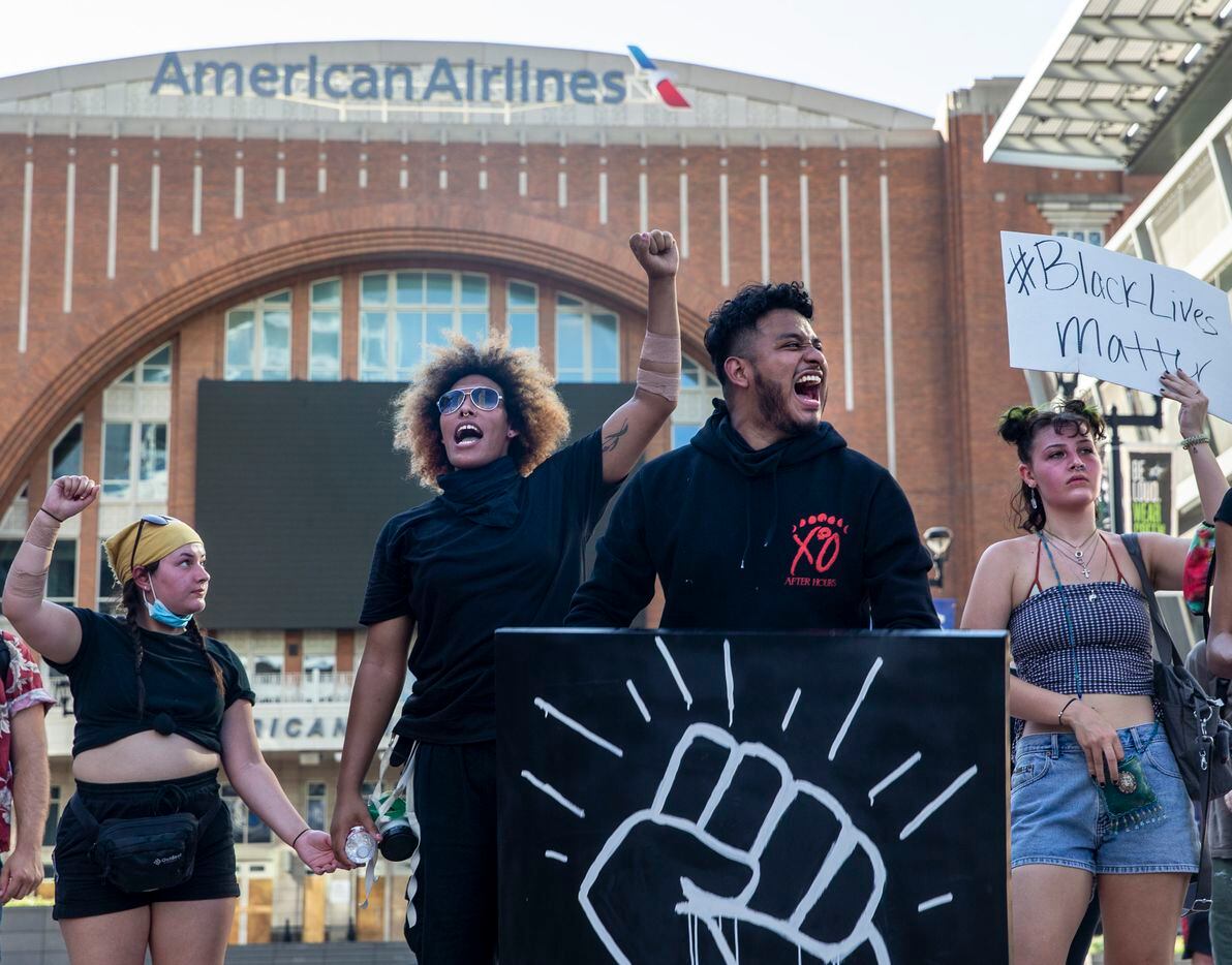 Miguel Ibarra (center right) shouts with other protesters during a demonstration at the American Airlines Center to denounce police brutality and systemic racism in Dallas on Thursday, June 4, 2020. The demonstration took place on the seventh consecutive day of organized protests in response to the recent deaths of George Floyd in Minneapolis and Breonna Taylor in Louisville.