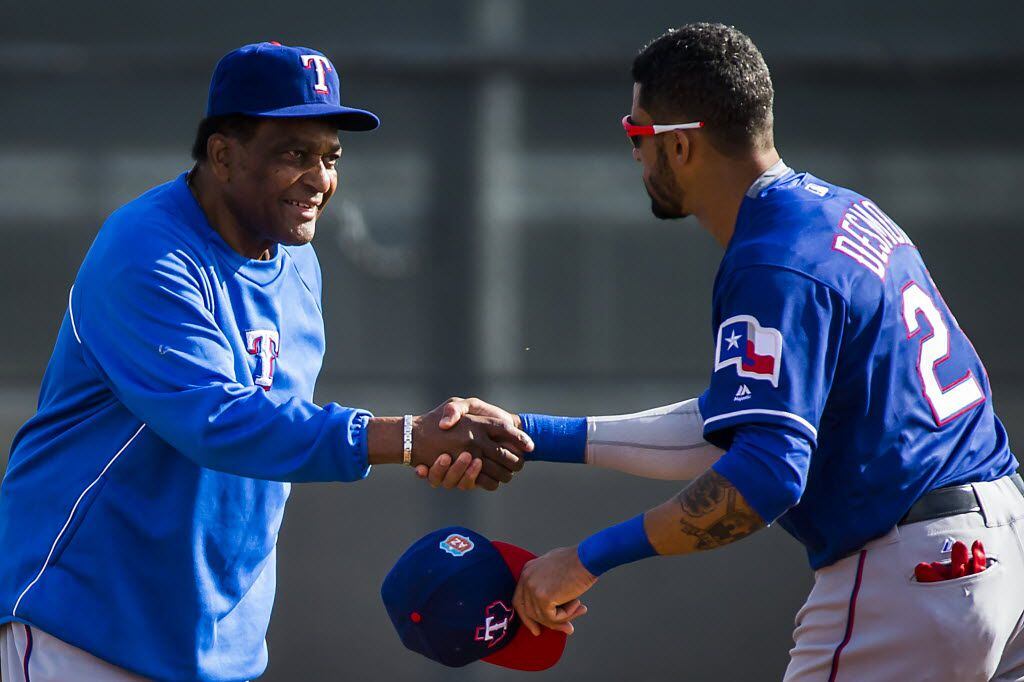 Texas Rangers outfielder Ian Desmond shakes hands with country music singer, and Rangers'...