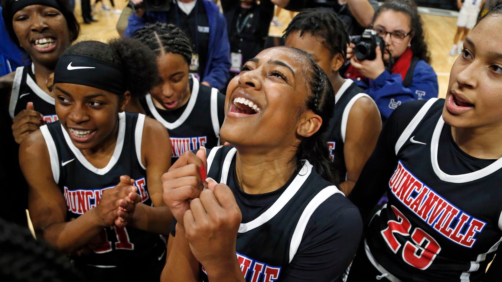 Duncanville guard Deja Kelly #25 celebrates with the rest of the team in a 6A final on  Saturday, March 7, 2020 at the Alamodome.