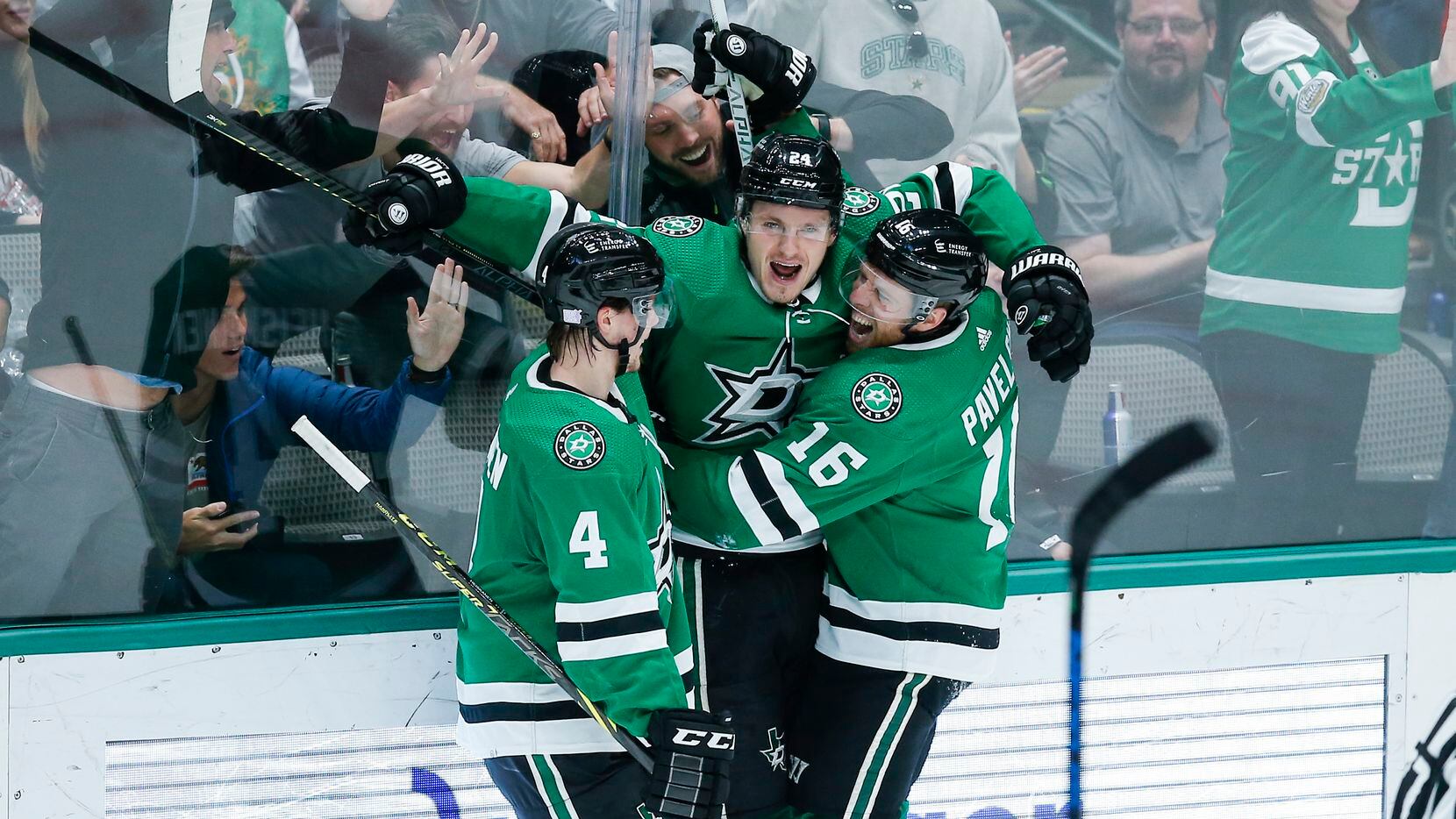 Dallas Stars forward Roope Hintz, center, is congratulated by defenseman Miro Heiskanen (4) and forward Joe Pavelski (16) after scoring a goal during the second period of an NHL hockey game against the Detroit Red Wings, Tuesday, November 16, 2021. (Brandon Wade/Special Contributor)