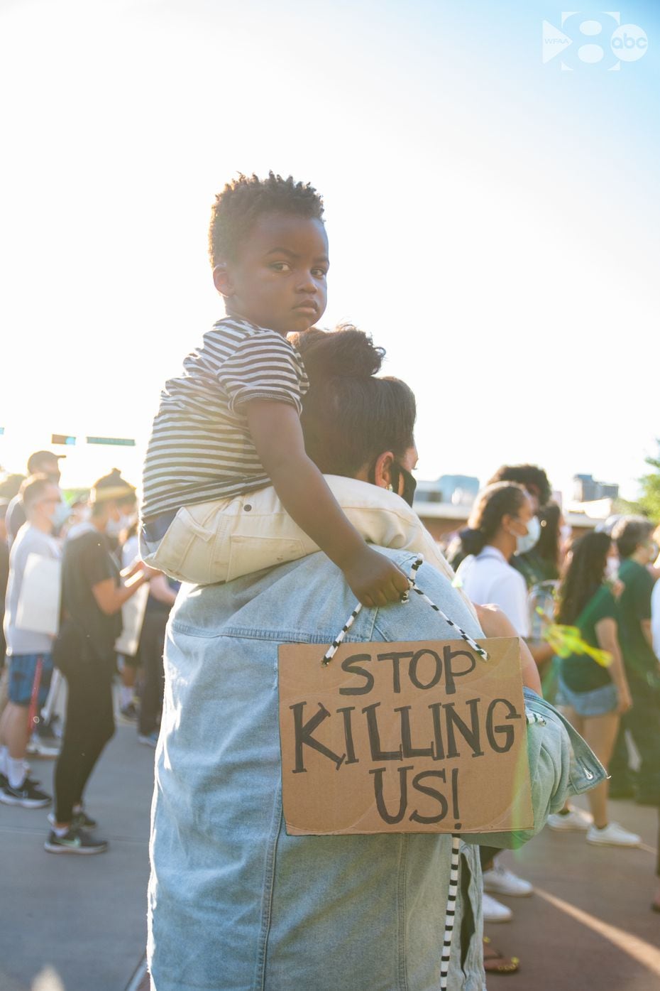Jantzen Verastique and her son Jonah, 3, demonstrating outside Dallas police headquarters on...