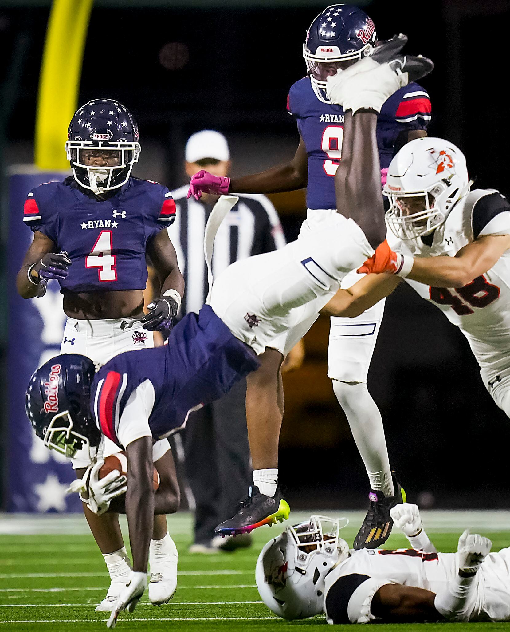 Denton Ryan’s Chance Rucker (7) is upended by Aledo defensive back Chris Johnson (6) on  a...