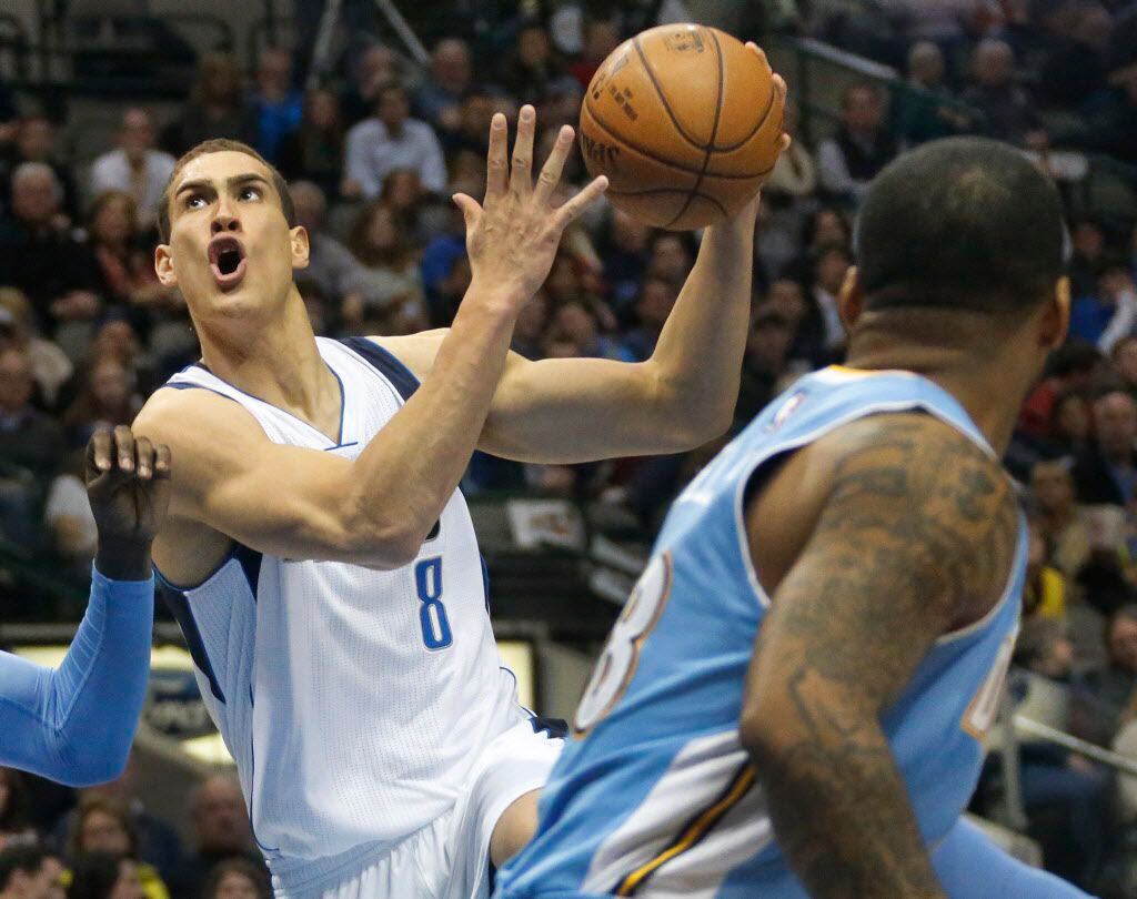 Dallas' Dwight Powell (8) drives past Jameer Nelson, right, in the first half during the...