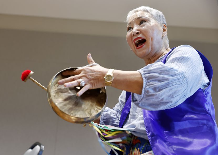 Arirang Texas Group member Kyong Cooper plays a kkwaenggwari as she practices samulnori at...