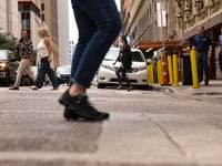 People cross Commerce St. in downtown Dallas on Monday, May 23, 2022 in Dallas,. A recent...