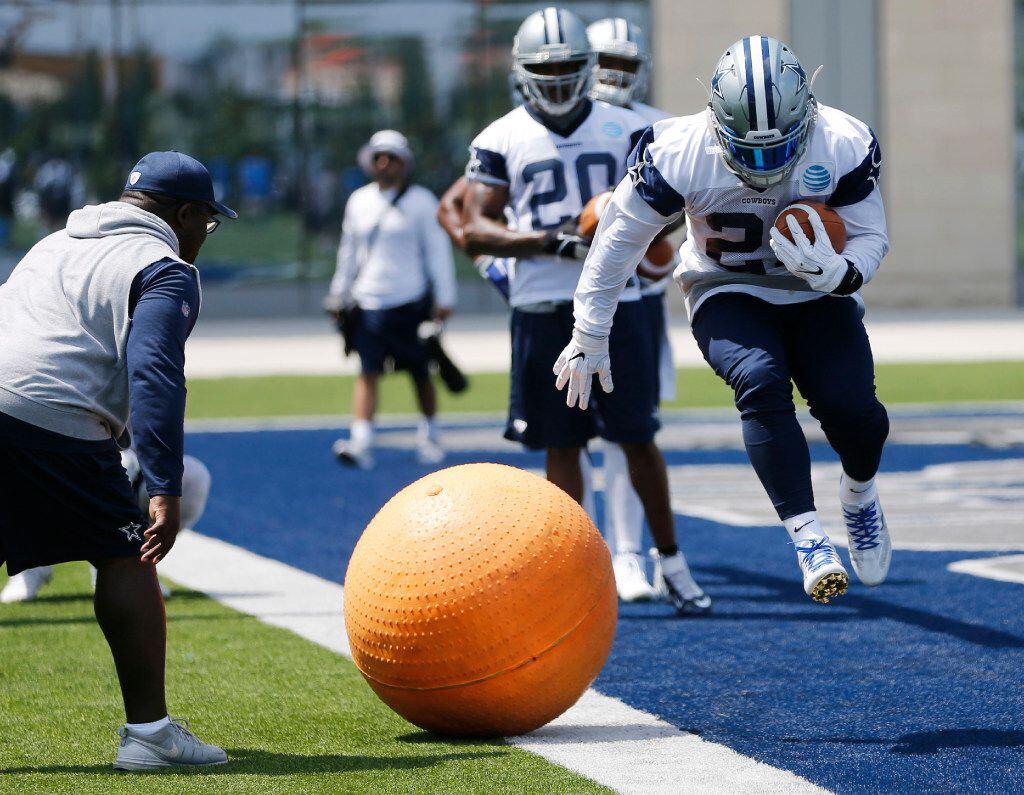 Dallas Cowboys Ezekiel Elliot (21) leaps during a drill in OTA's at the Star in Frisco on...