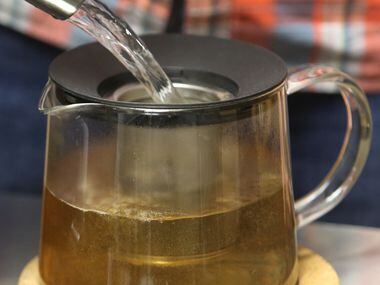 Friedman makes a pot of Himalayan Golden Tips tea at Rakkasan Tea Company in Deep Ellum.