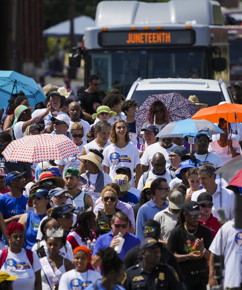 A Trinity Metro bus leads a caravan trailing walkers during the 2022 Opal's Walk for Freedom...