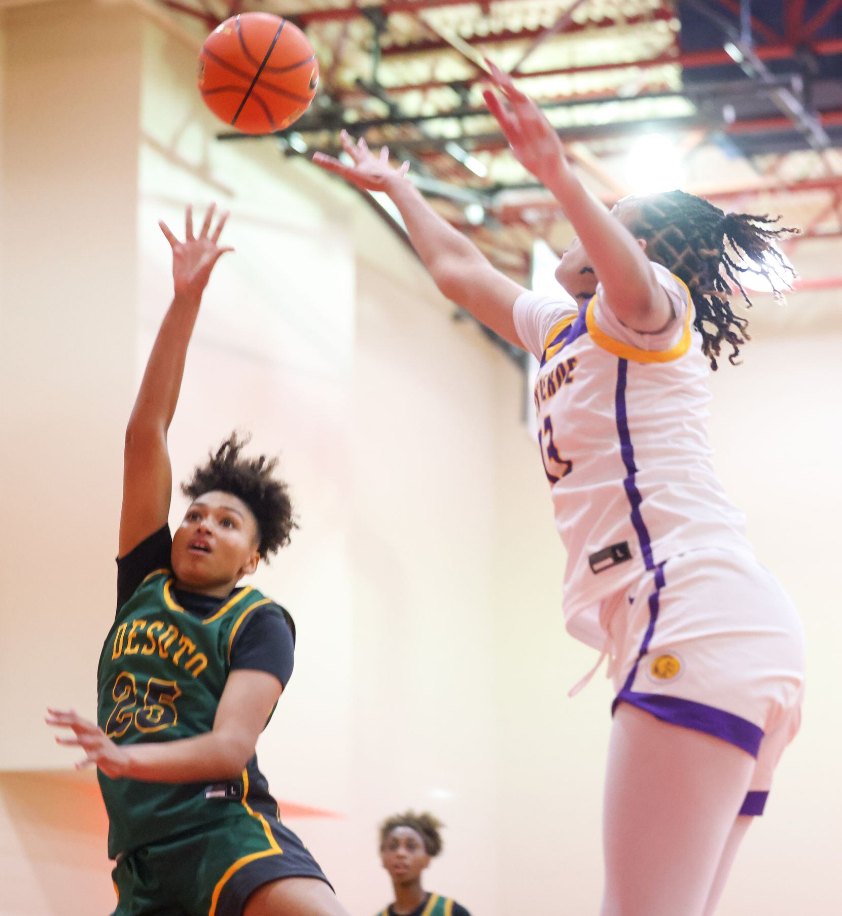 DeSoto shooting guard Amayah Garcia (25) attempts a shot at the net during a game against...