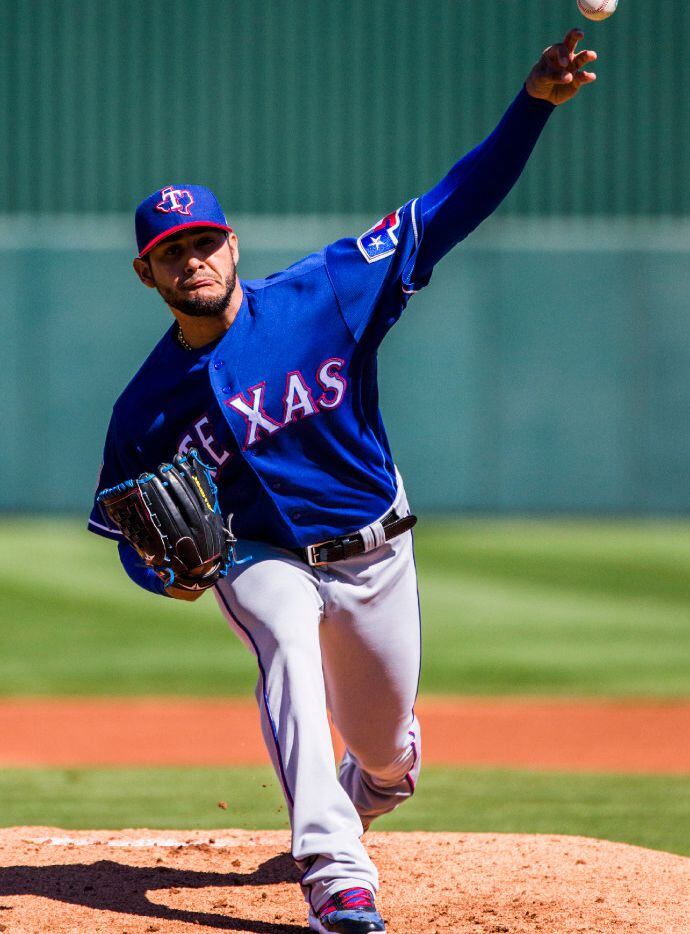 Texas Rangers starting pitcher Martin Perez (33) pitches during the first inning of a spring...