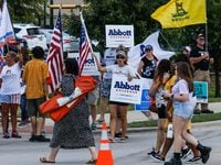 Supporters of Texas Gov. Greg Abbott gathered outside the Frisco venue where his Democratic...