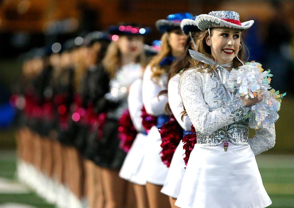 Samantha Hebert, a captain with the Plano West High School Royales drill team, stands at...