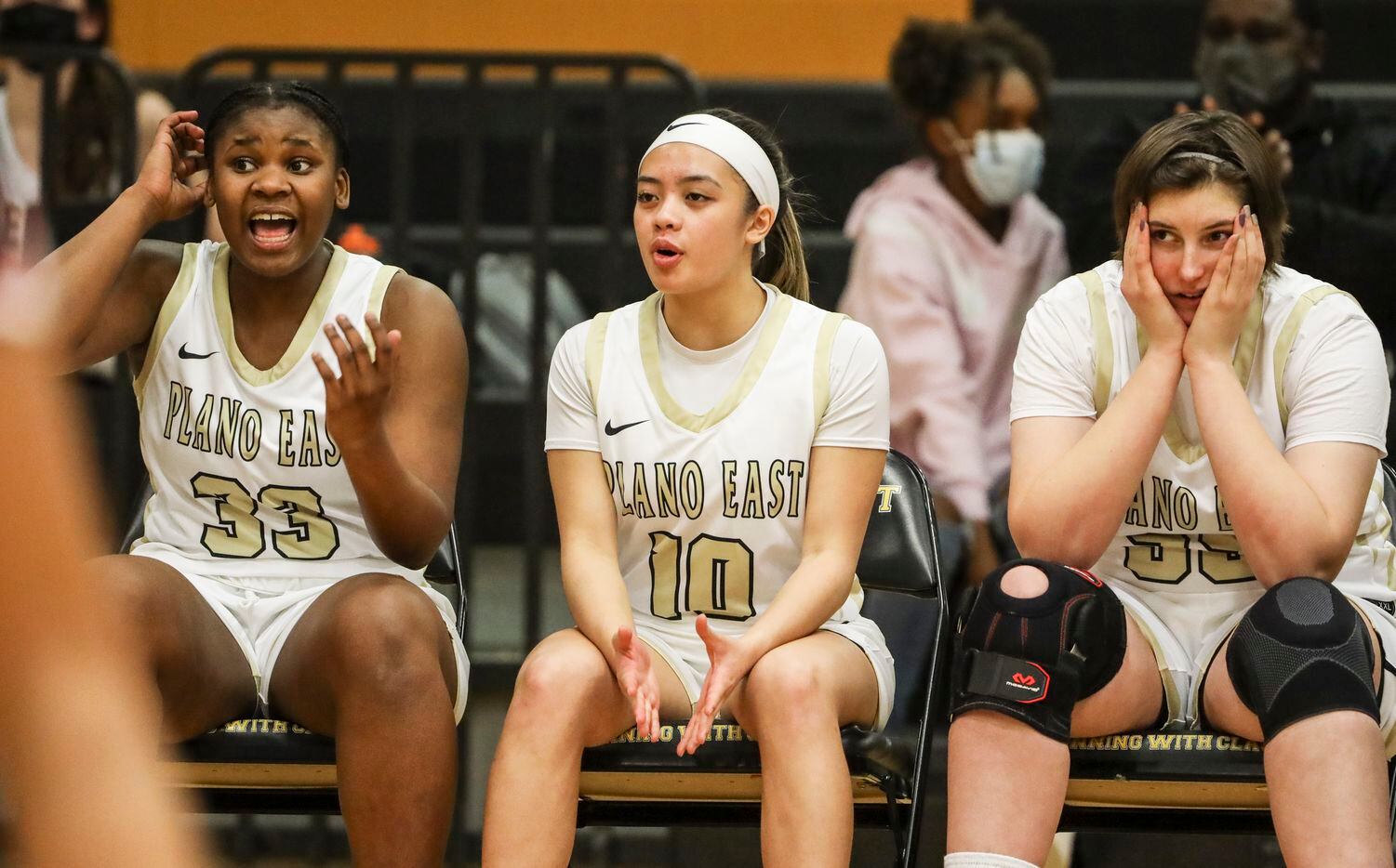 The Plano East High School woman’s basketball team bench reacts to the play in the fourth...