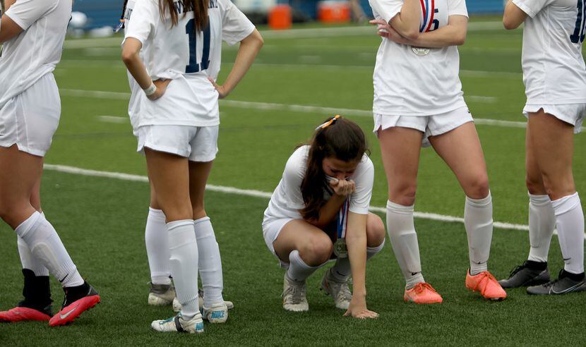 Wakeland's Rachel Perry (2) reacts after the UIL 5A girls State championship soccer game...