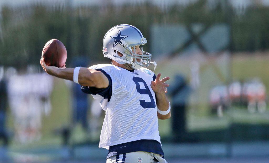 Dallas Cowboys quarterback Tony Romo (9) passes during an NFL football team practice in...