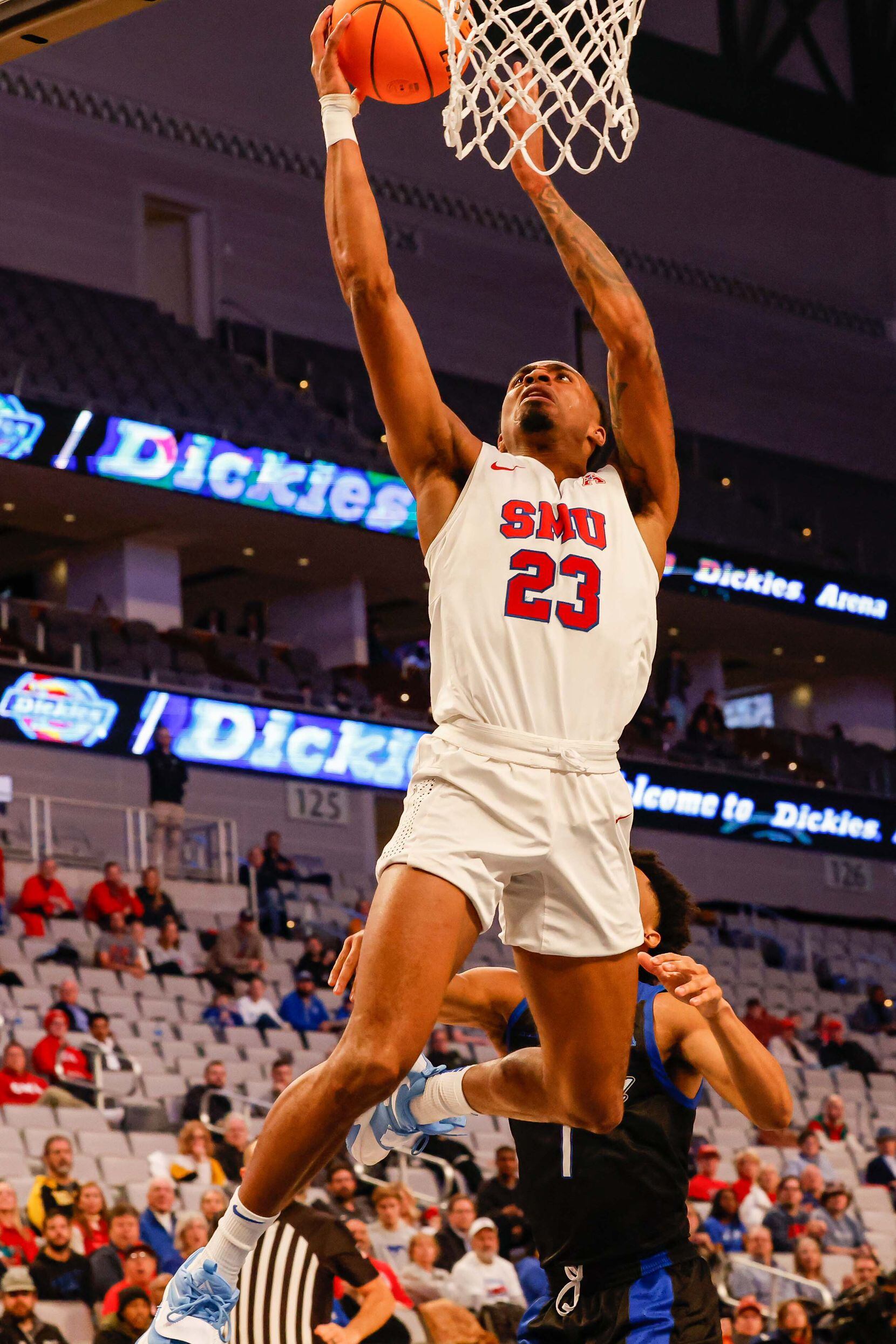 Southern Methodist Mustangs guard Michael Weathers (23) goes for a shot during the first...