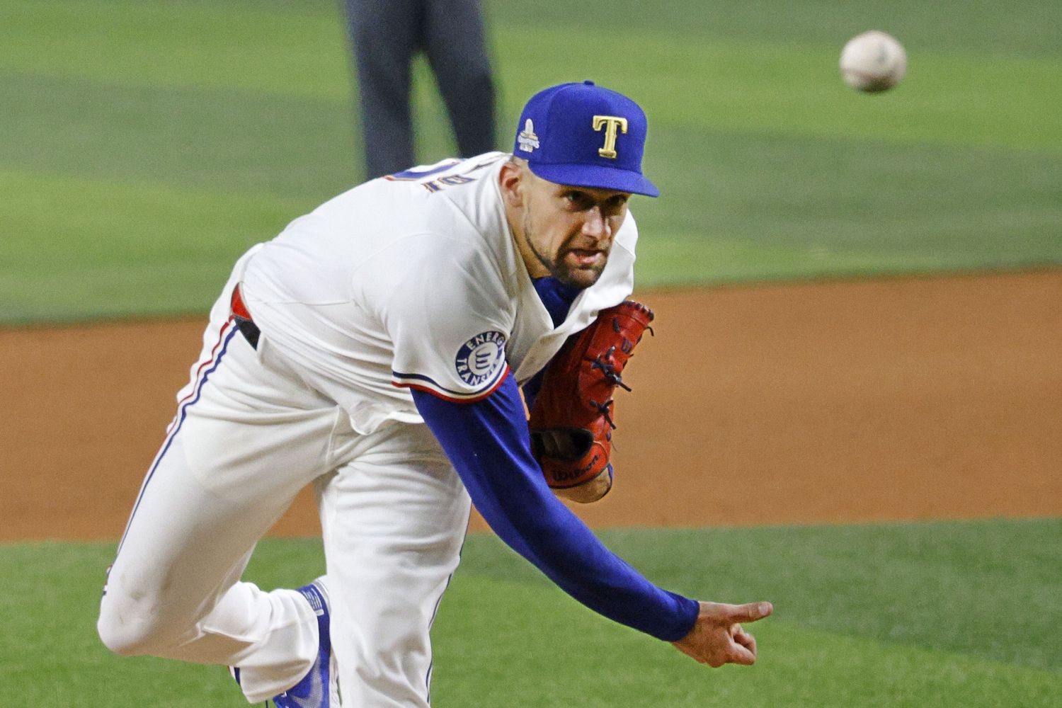 Texas Rangers starting pitcher Nathan Eovaldi (17) delivers during the fourth inning of an...