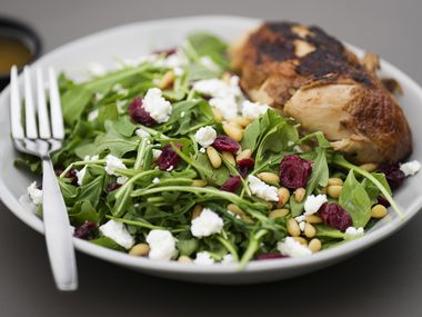 The Classic salad with rotisserie chicken, arugula, pine nuts, cranberries, goat cheese, red...