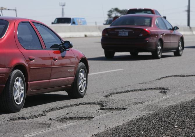 Potholes shown on a freeway in Dallas.