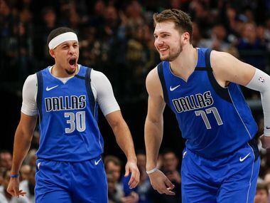 Dallas Mavericks forward Luka Doncic (77) celebrates scoring alongside guard Seth Curry (30) during the second half of a NBA basketball game between the Dallas Mavericks and the Charlotte Hornets on Saturday, Jan. 4, 2019 at American Airlines Center in Dallas.