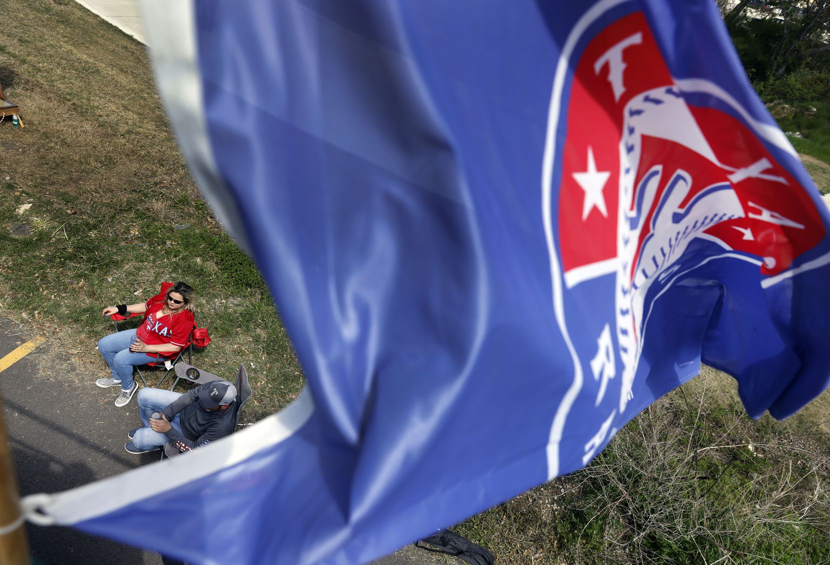 Texas Rangers fans enjoy an Opening Day tailgate party on private property outside of Globe Life Field in Arlington, Monday, April 5, 2021. The Rangers are facing the Toronto Blue Jays in the home opener. (Tom Fox/The Dallas Morning News)